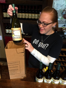 Tasting room staff member Sarah Ruggiero packing the vineyard's first online order Monday.