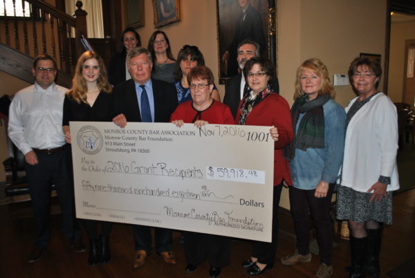 Organizations countywide gathered November 7 to collect Monroe County Bar Foundation grant funding (front from left) Kevin Yurko, Pocono Alliance; Anna Underwood, Monroe County Historical Association; William Reaser, Monroe County Bar Foundation; Diane Dagger, Monroe County Bar Foundation; Roxanne Powell, Pocono Alliance; Heidi Fareri, Monroe County Meals on Wheels; Sue Folk, Developmental Education Services of Monroe County; (back from left) Lara Kash, Monroe County Bar Foundation; Linda Rice, Pocono Alliance; Jennifer Pandolfo, Center for Vision Loss Monroe County; Tim Lee, Pocono Services for Families and Children Monroe County Head Start 